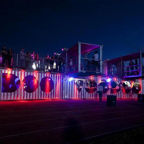 What are the uses of shipping containers in various festivals?